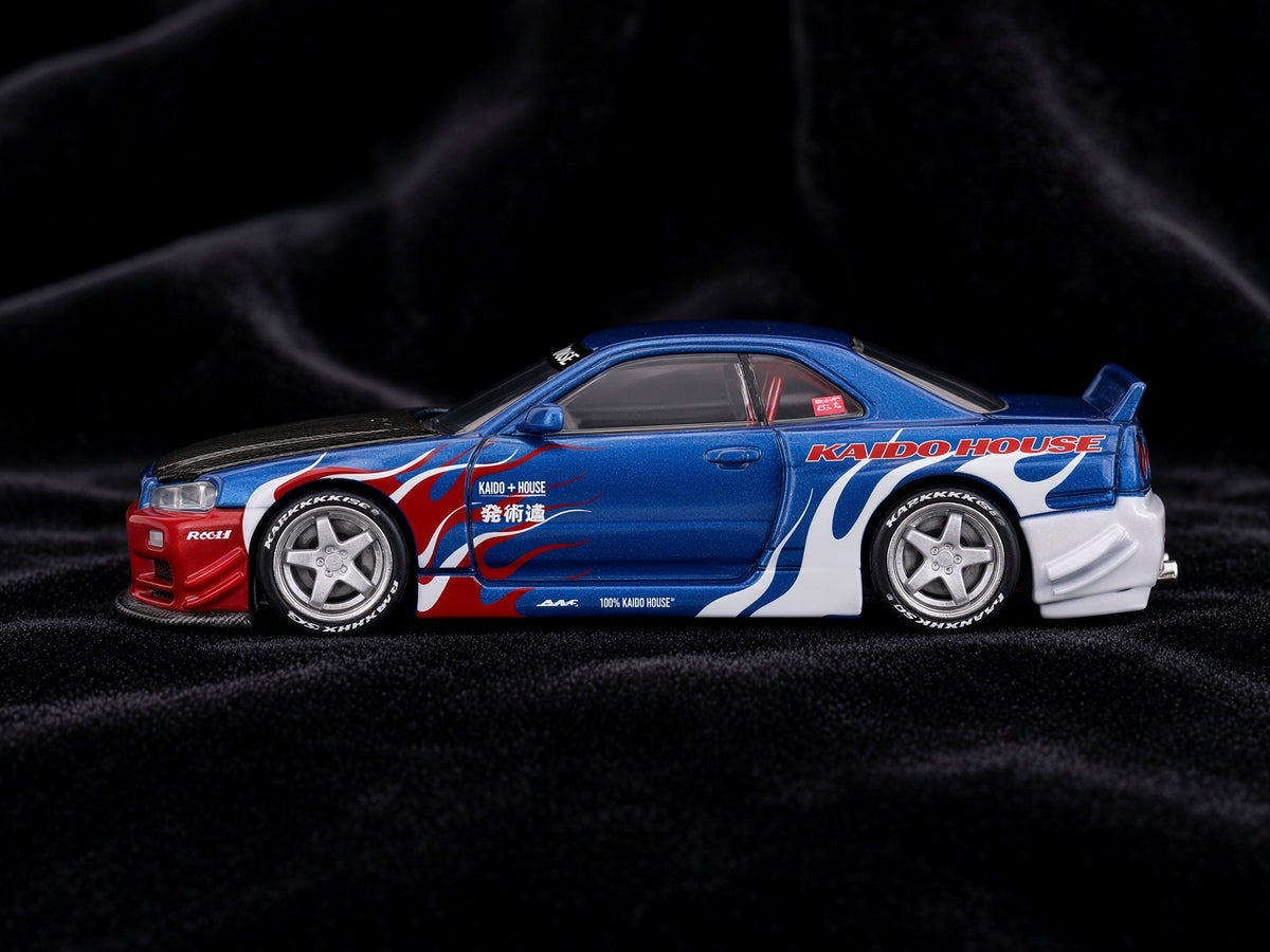 Mini GT – Nissan Skyline GT-R (R34)  Kaido House - Kaido Flames V1 1999 – Blue Red (1:64)
